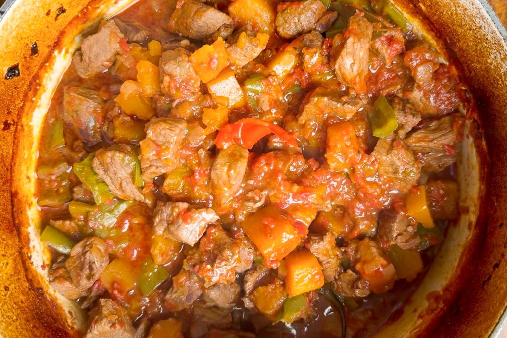The cooked beef stew in the pan.