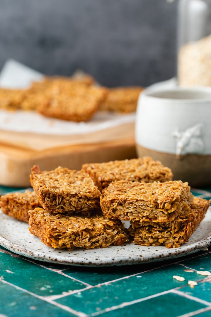 A plate of British flapjacks served with a mug of tea.