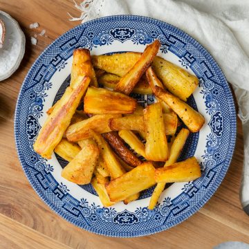 A plate of roasted parsnips ready to serve.