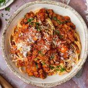 A bowl of spaghetti and slow cooker bolognese sauce.