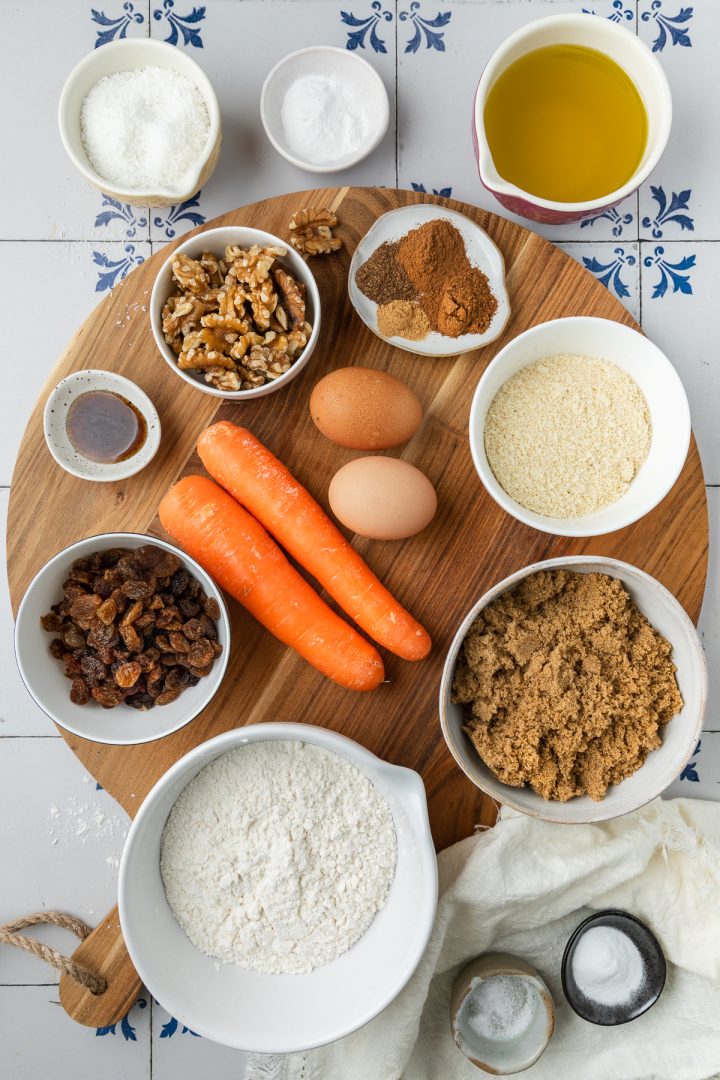 Ingredients needed to make the carrot cake recipe weighed out and placed on individual bowls.