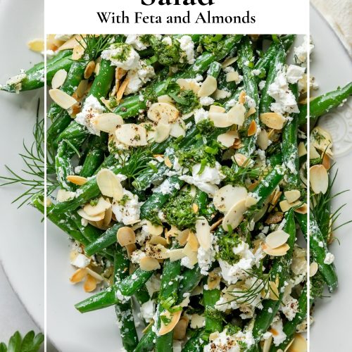 A plate of green bean salad with a text overlay to create a pin for Pinterest.