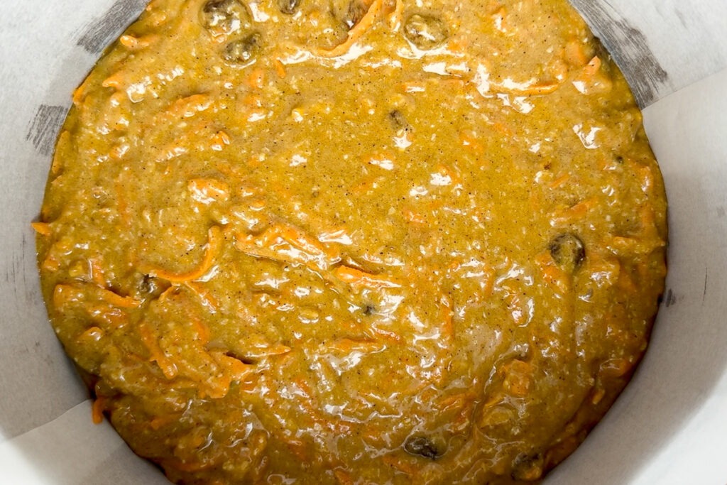 The carrot cake batter in the lined tin ready to bake.