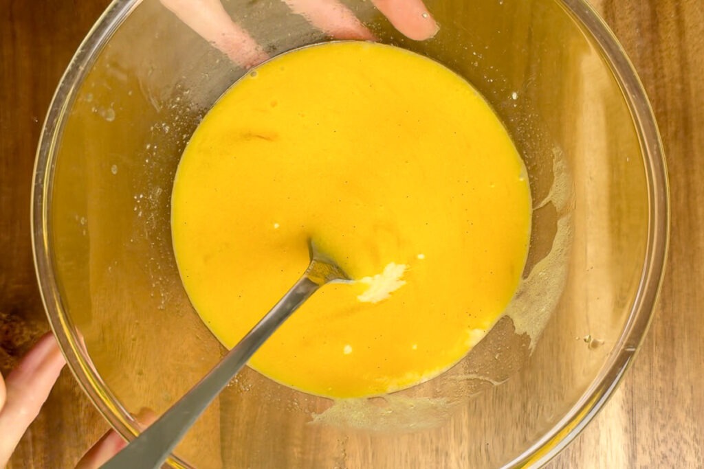 The whisked eggs, melted butter and vanilla.