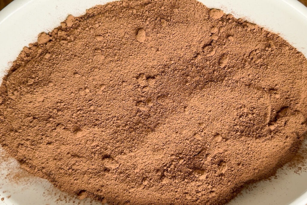 The dry ingredients of the sauce sprinkled over the sponge.