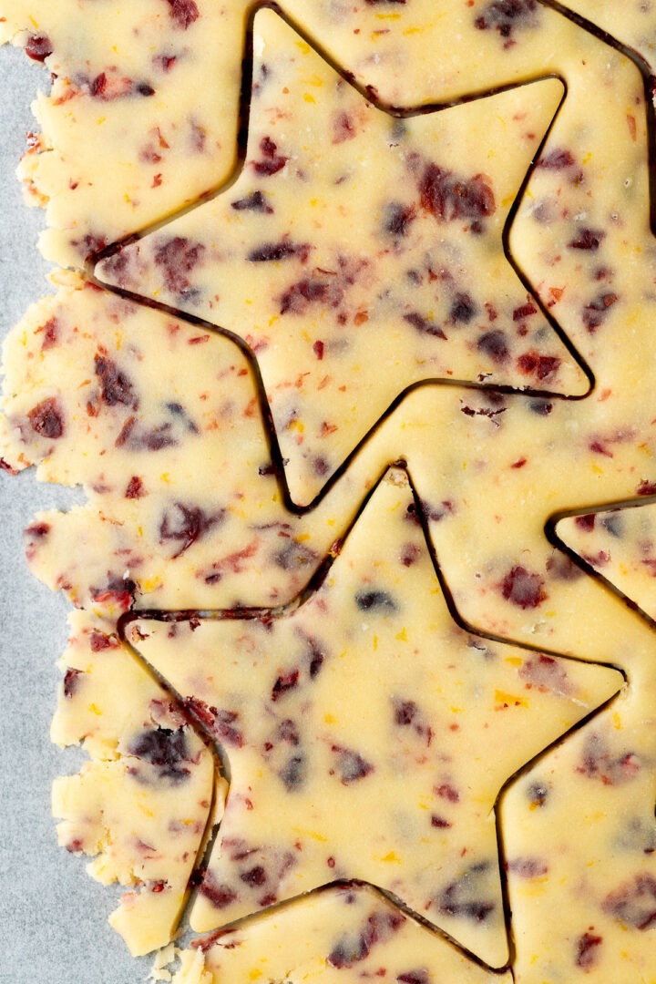 Close up of the shortbread dough with two stars cut out of it.