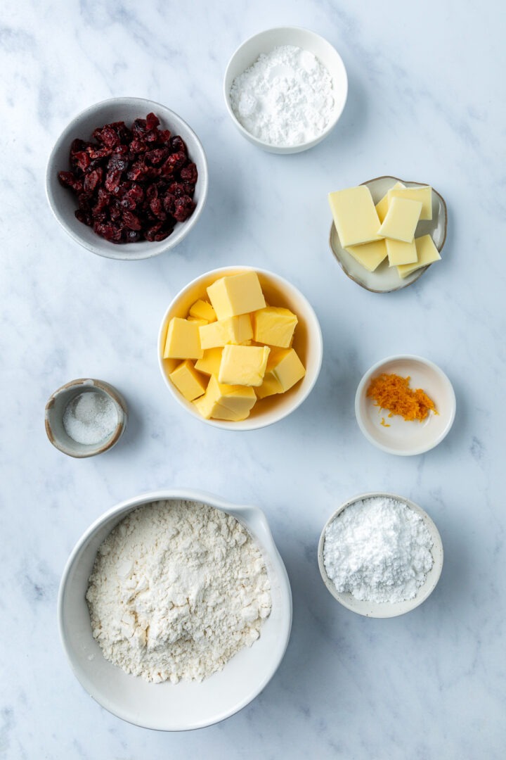 The ingredients needed to make the recipe weighed out in individual bowls.