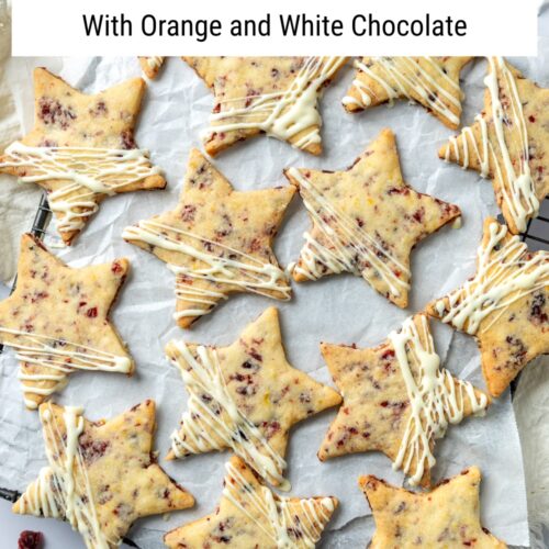 A selection of cranberry shortbread cookies on a cooling rack with a text overlay to create a pin for Pinterest.