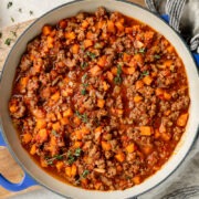 A pan of savoury minced on a wooden board.