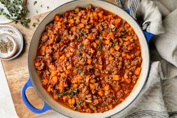 A pan of savoury minced on a wooden board.