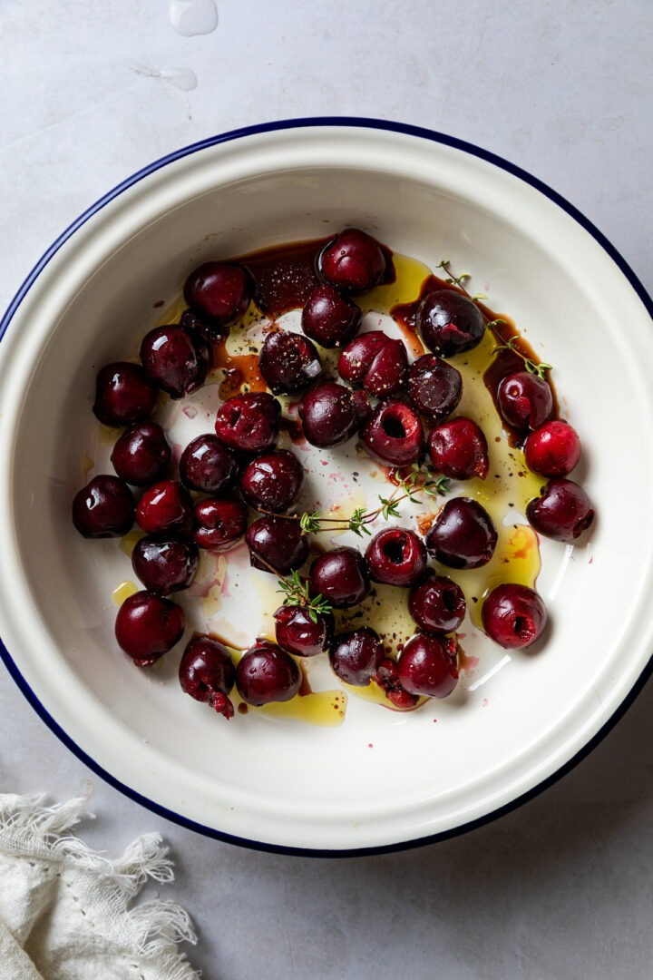 Pitted cherries drizzled with olive oil and vinegar and sprinkled with salt and pepper.