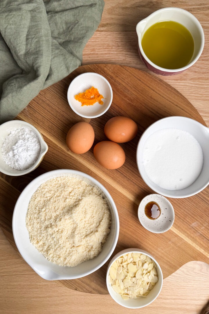 Ingredients needed to make mandarin cake weighed out and placed in individual bowls.