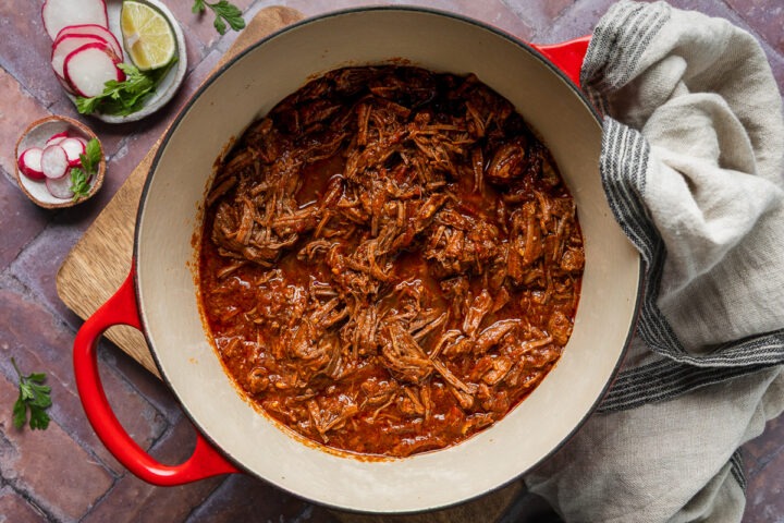 A pan of home cooked slow cooked pulled beef.